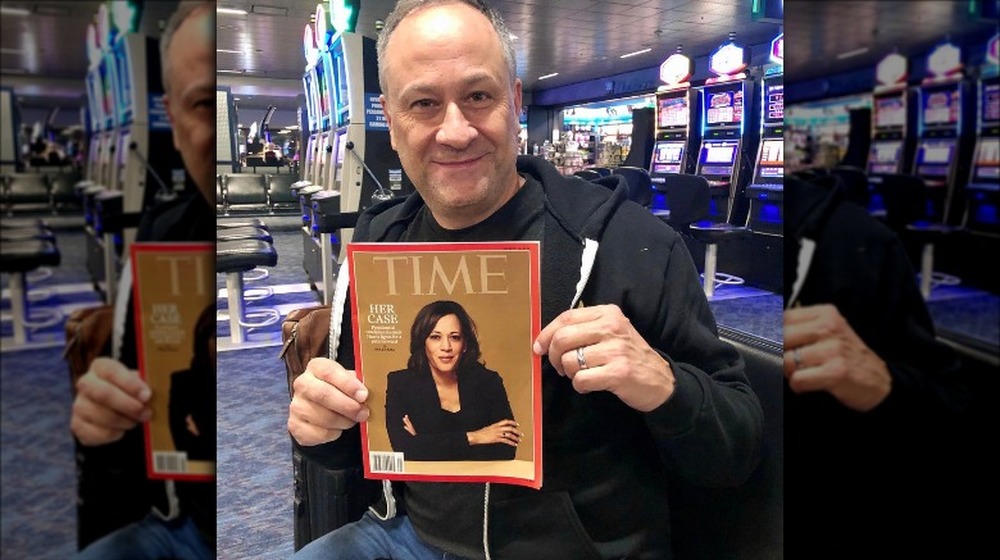 Doug Emhoff holding Time magazine