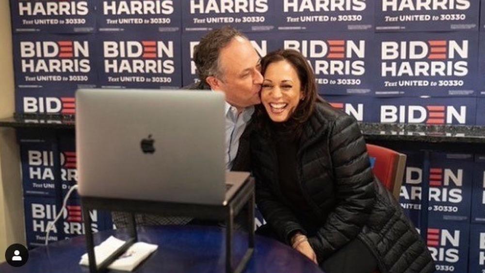 Doug Emhoff smooching Kamala Harris on the cheek