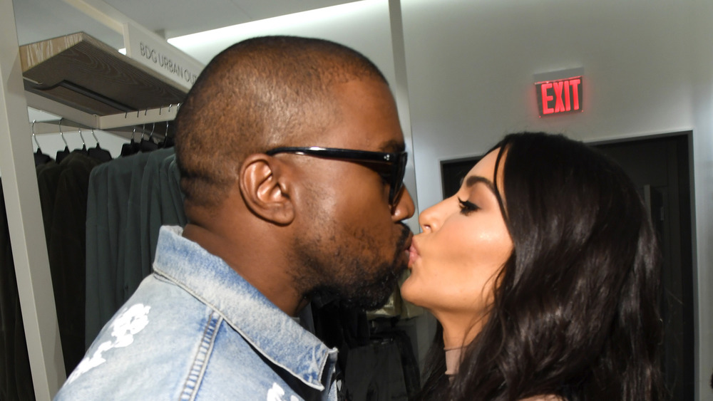 Kanye West and Kim Kardashian smooching 