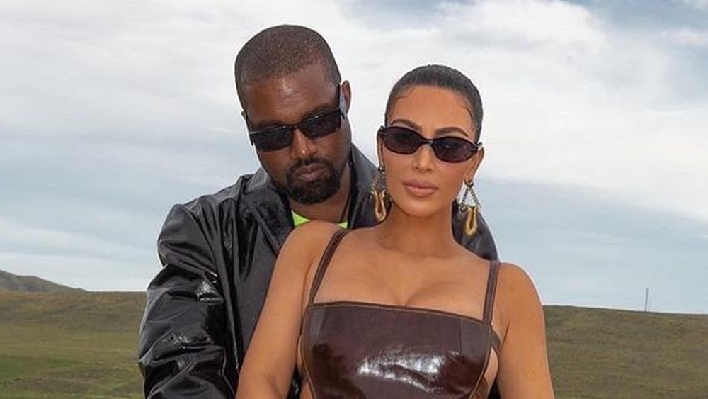 Kim Kardashian and Kanye West outside