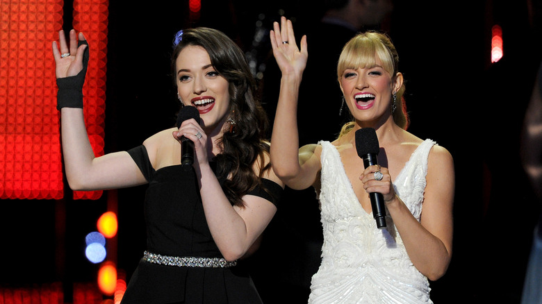 Kat Dennings and Beth Behrs present onstage