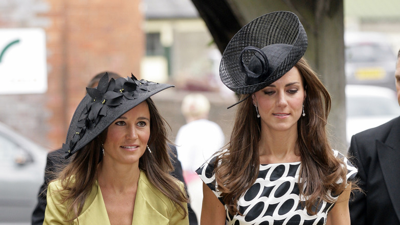 Pippa and Kate Middleton at a wedding