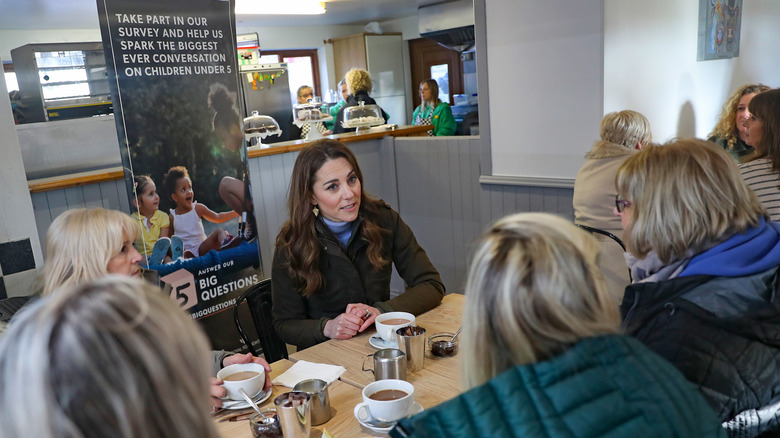 Kate Middleton talking to women at restaurant