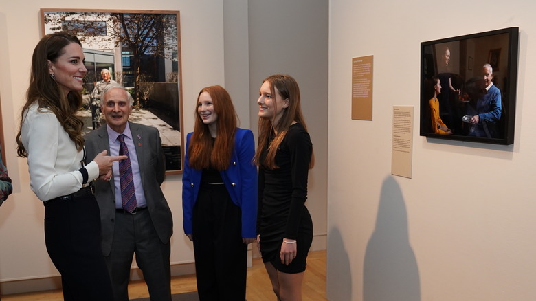 Kate Middleton speaking with people at museum