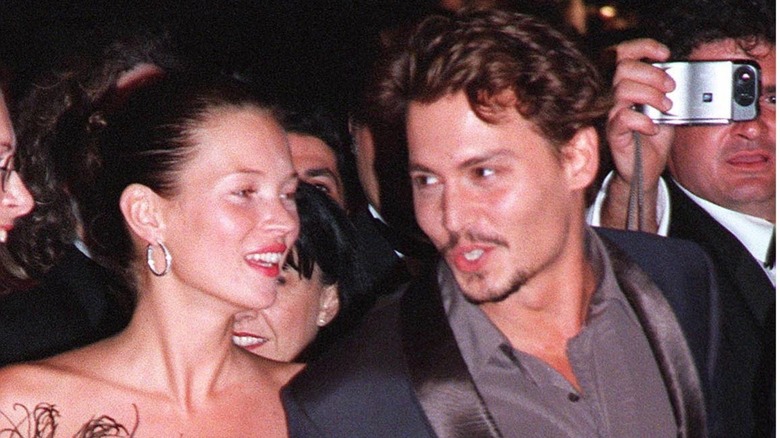 Johnny Depp and Kate Moss laughing
