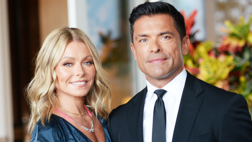 Kelly Ripa and Mark Consuelos wearing blue