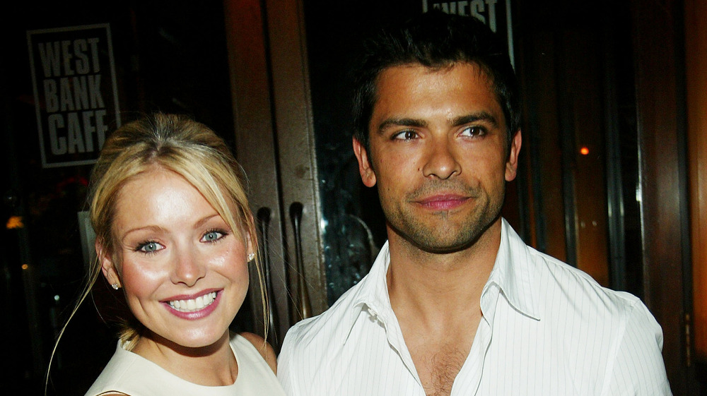 Kelly Ripa and Mark Consuelos wearing white