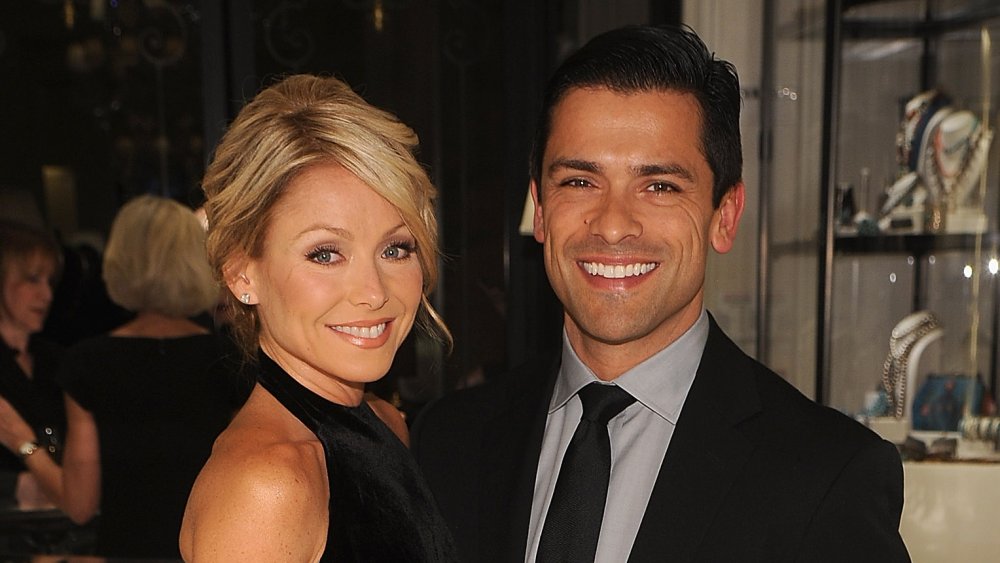 Kelly Ripa and Mark Consuelos in a lobby