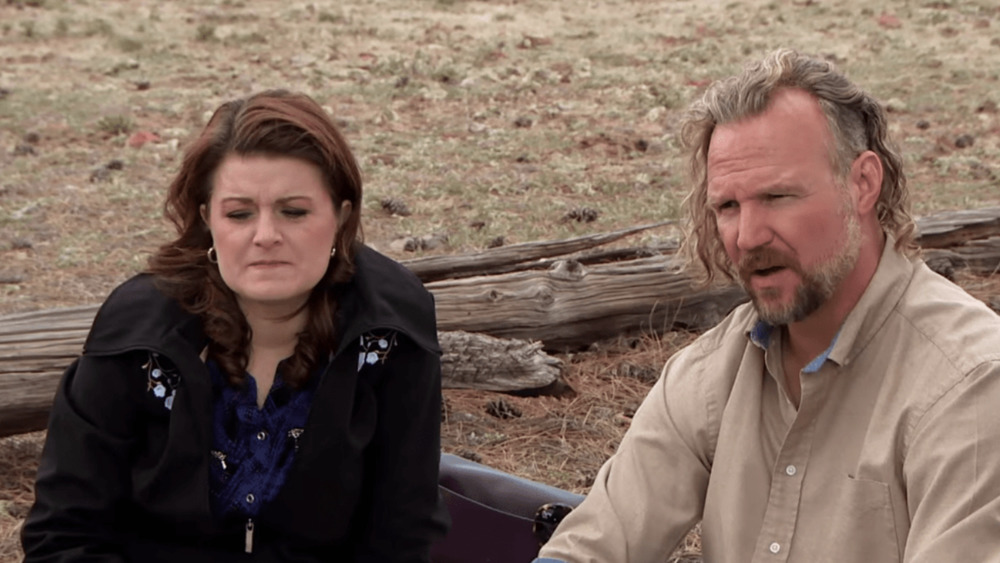 Kody and Robyn Brown sitting outside