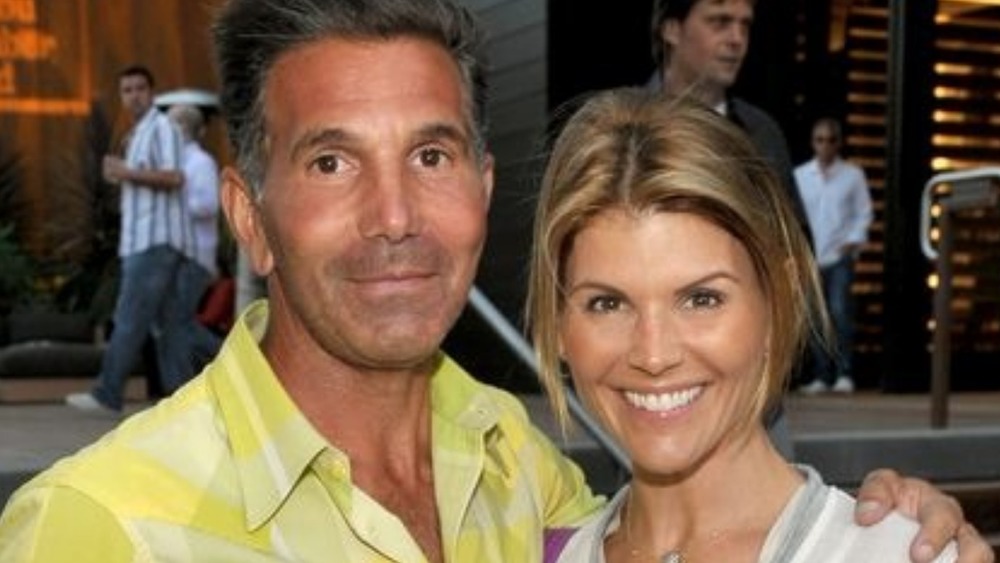 Lori Loughlin and Mossimo Giannulli in front of a building