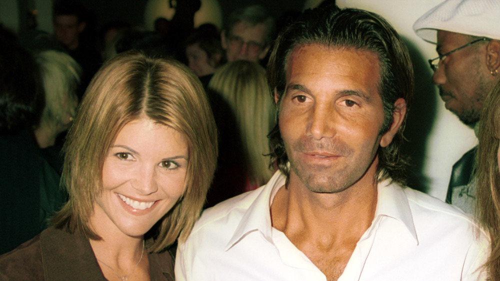 Lori Loughlin and Mossimo Giannulli in front of a crowd