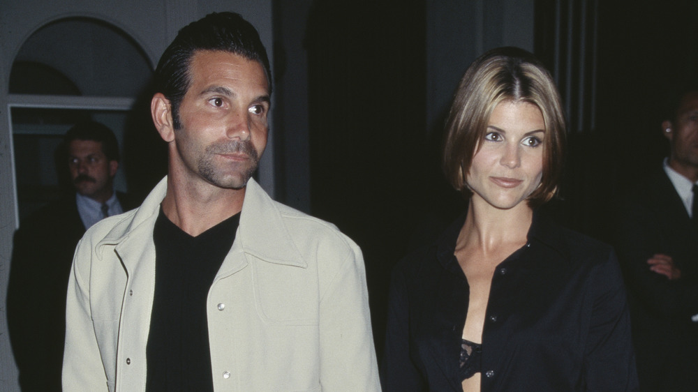 Lori Loughlin and Mossimo Giannulli looking to the side