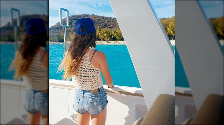 Bella Giannulli on a boat facing away