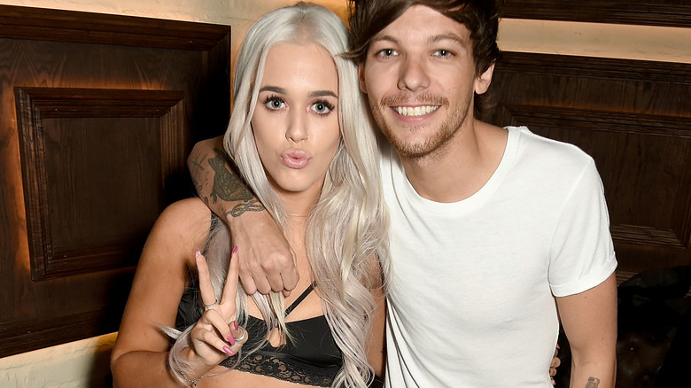 Lottie Tomlinson and her brother Louis Tomlinson of One Direction pose for a photo