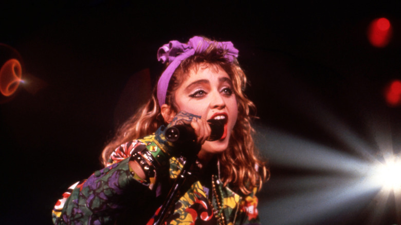 Madonna singing with purple head band in the 1980s