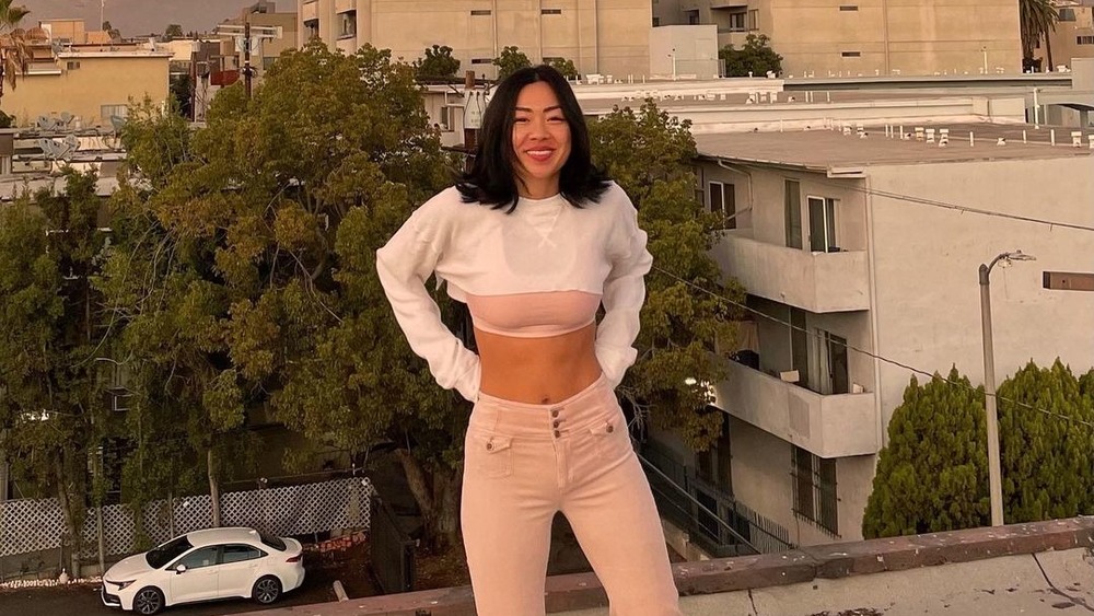 Kim Li in a white top