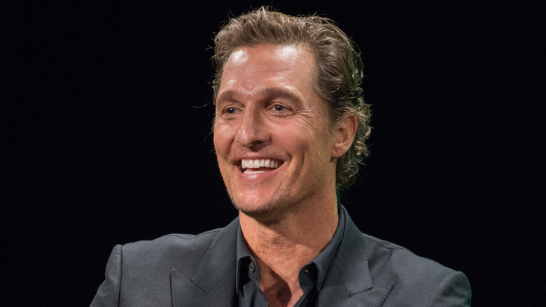 Matthew McConaughey smiling onstage