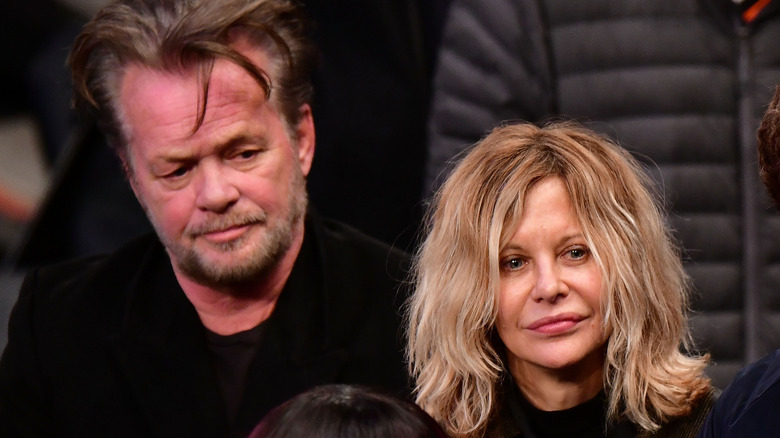 John Mellencamp and Meg Ryan at basketball game