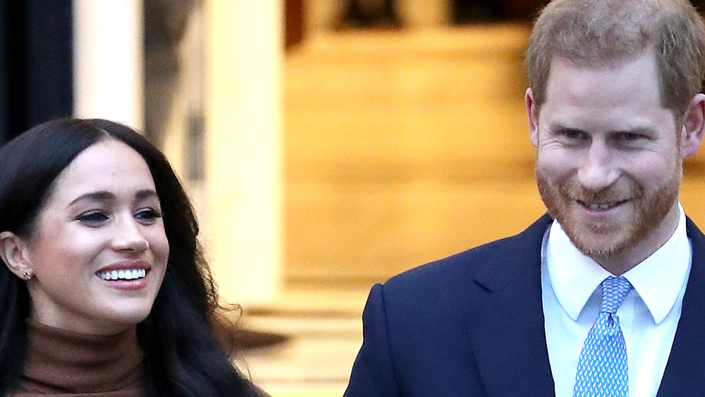 Meghan Markle and Prince Harry walk together