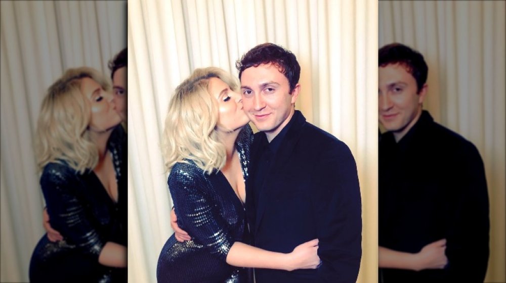 Meghan Trainor hugging and kissing Daryl Sabara