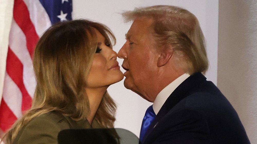 Donald Trump and Melania Trump going in for a kiss