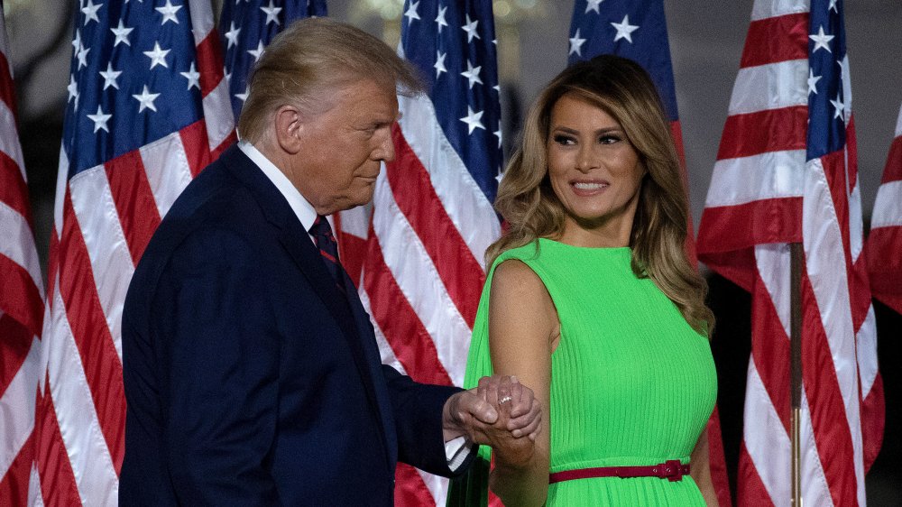 Donald Trump and Melania Trump holding hands