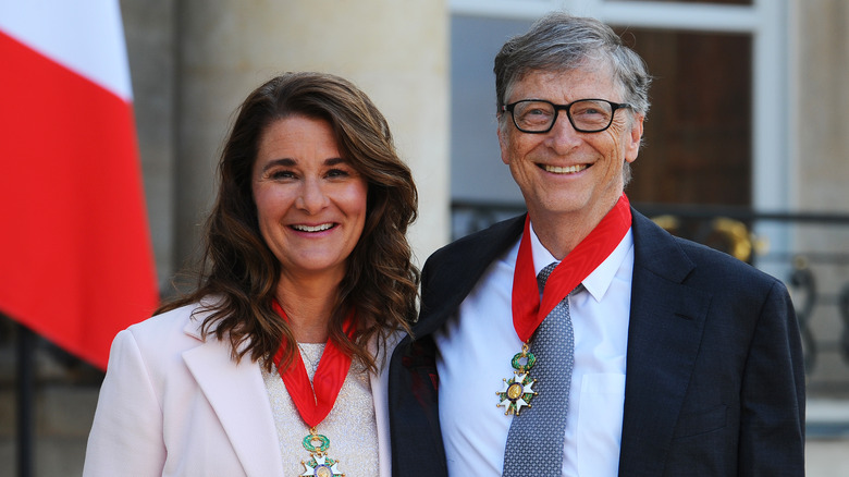 Melinda Gates and Bill Gates wearing medals