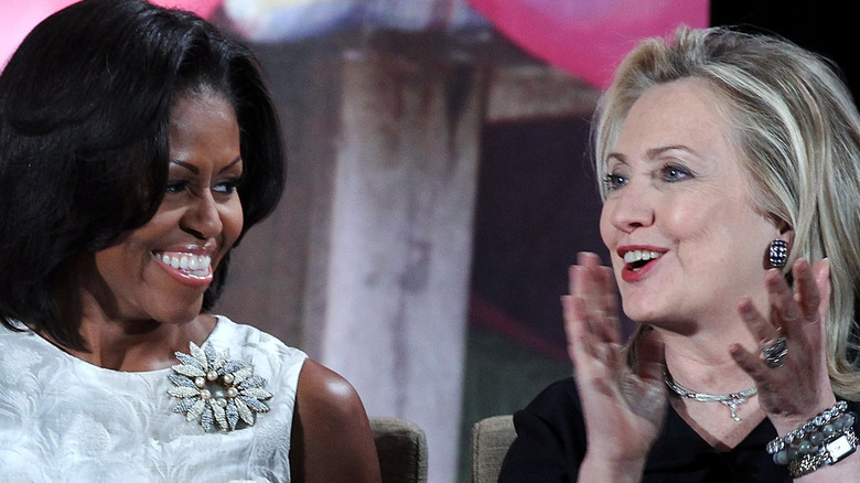 Michelle Obama and Hillary Clinton at event 