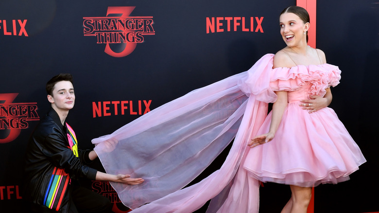 Noah Schnapp and Millie Bobby Brown goof around on the red carpet