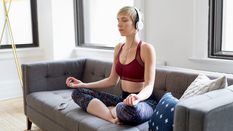 woman practicing mindfulness on the couch