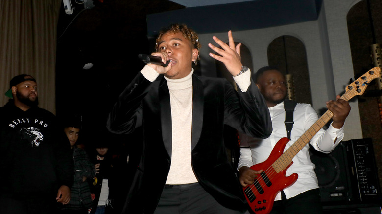 Cordae performing at a concert