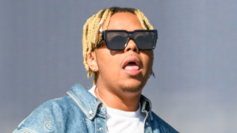 Cordae performing wearing sunglasses