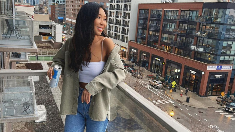 Natalie Lee posing on a balcony