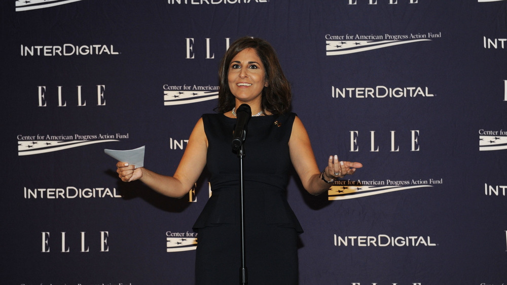 Neera Tanden smiling while speaking