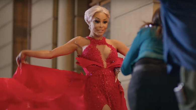 Khanyi Mbau posing in red dress for photos 