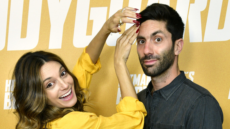 Laura Perlongo fixes husband Nev Schulman's hair