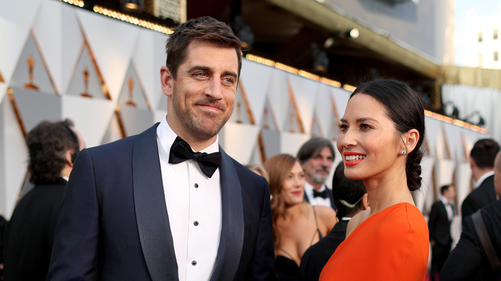 Olivia Munn and Aaron Rodgers attend an event