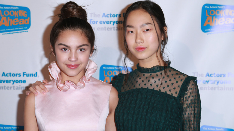 Olivia Rodrigo and Madison Hu posing on red carpet