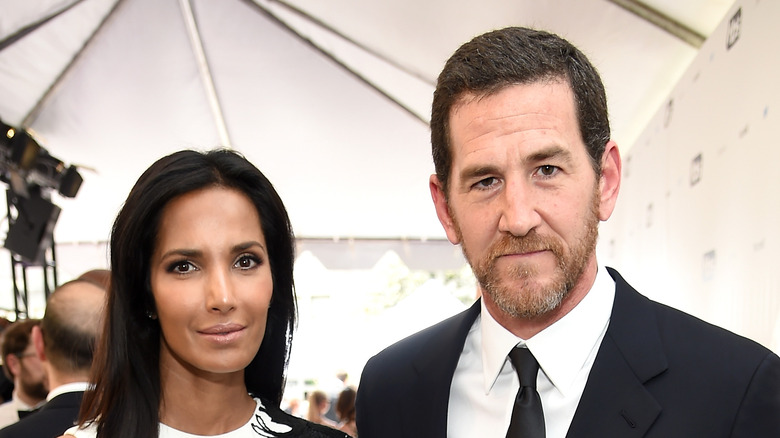 Padma Lakshmi and Adam Dell pose on the red carpet together