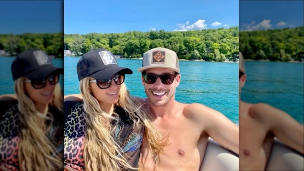 Paris Hilton and Carter Reum on a boat, smiling