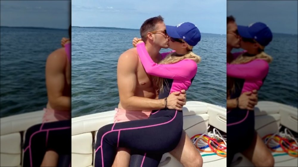 Paris Hilton and Carter Reum smooching on a boat