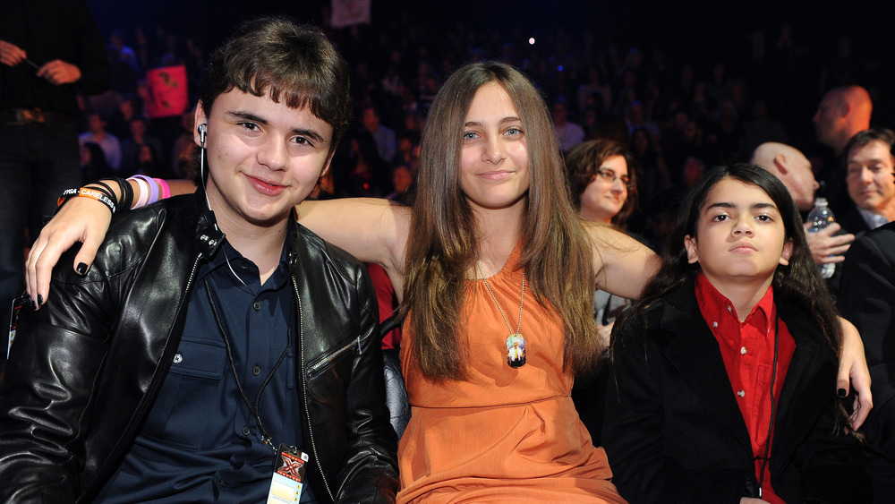 Prince, Paris, and Blanket Jackson at a concert