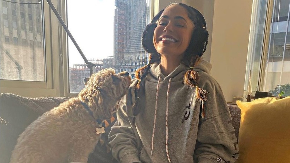 Olivia Amato sitting with her dog