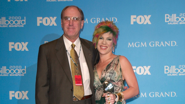 Pink and her father, Jim Moore, smiling at an awards show