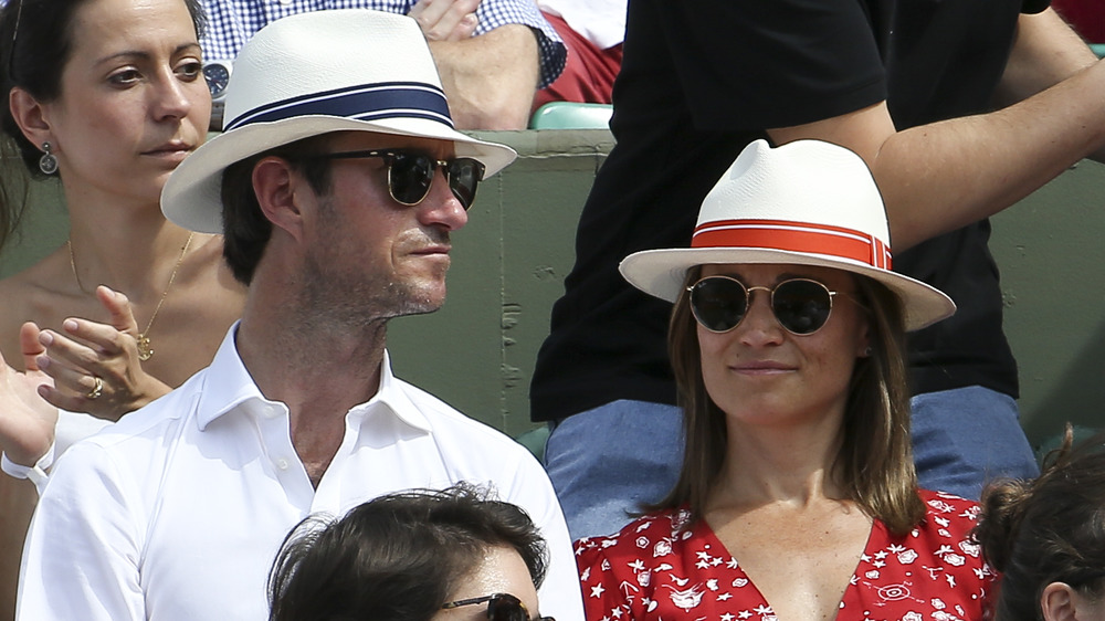 Pippa Middleton and James Matthews in a sports stand 