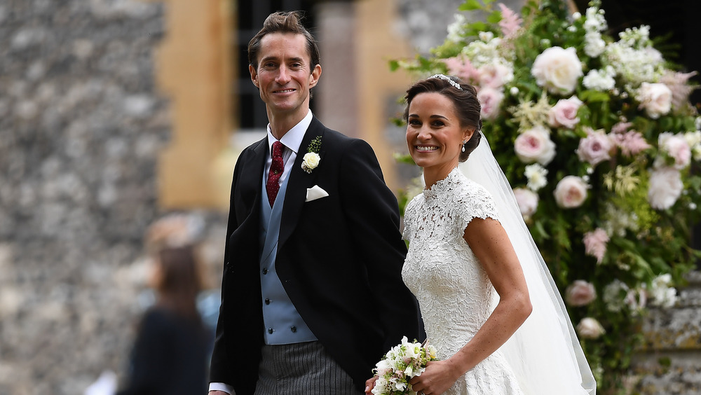 James Matthews and Pippa Middleton on their wedding day, smiling