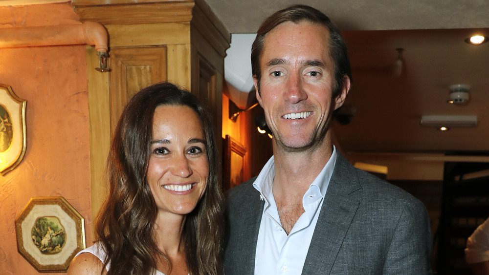 Pippa Middleton and James Matthews inside, smiling