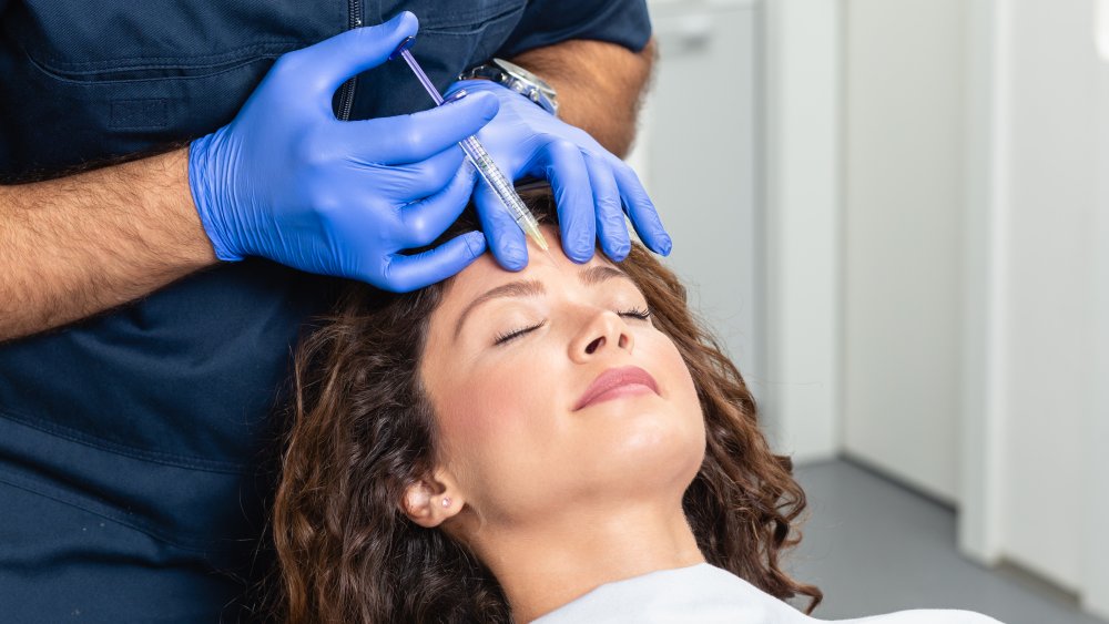 A woman receiivng Botox in her face 