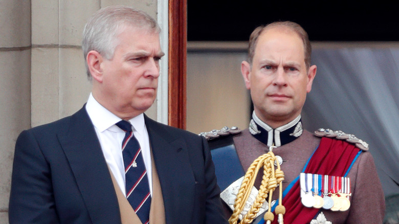 Prince Andrew and Prince Edward looking serious