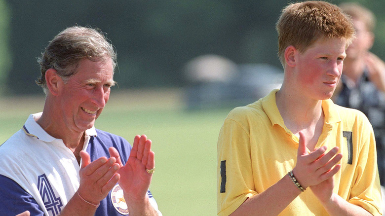 Prince Harry and King Charles clapping